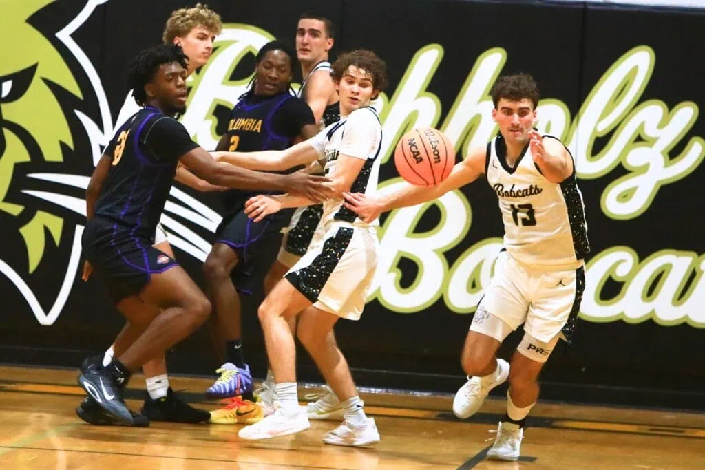 Buchholz's Jamison McTureous (13) tracks down a loose ball against Columbia. Photo by C.J. Gish 1
