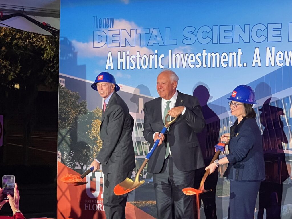 (From left) UF interim President Donald Landry, Board of Trustees Chair Mori Hosseini and College of Dentistry Dean Isabel Garcia break ground on the addition and renovation project.