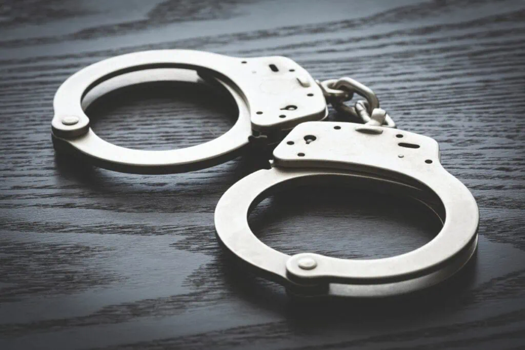 Handcuffs arrested. Metro Creative