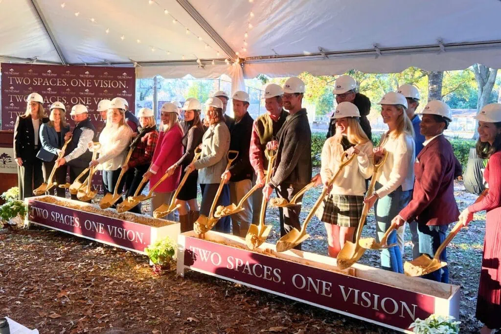 Oak Hall School leaders and supporters pose for a photo before the ceremonial tossing of the dirt on Wednesday afternoon. Photo by Nick Anschultz