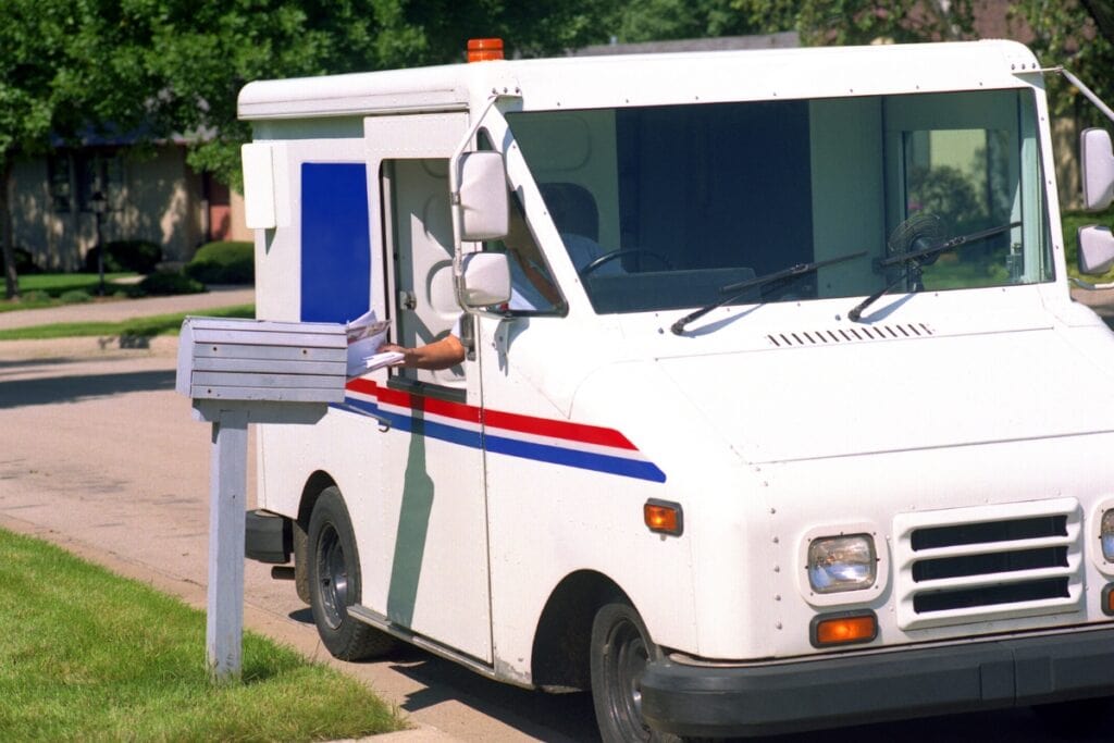 U.S. Post Office vehicle delivering mail. Metro Creative