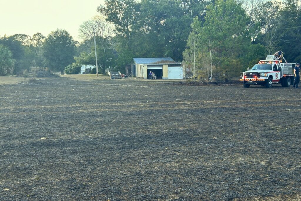 Firefighters extinguished a brush fire north of Newberry that threatened three homes on Wednesday afternoon. Courtesy of ACFR