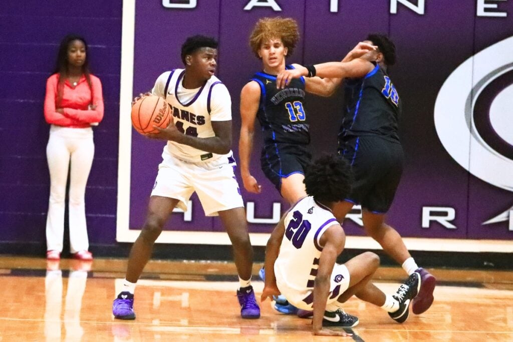 Gainesville's AJ Hall (44) pulls down a rebound against Newberry. Photo by C.J. Gish
