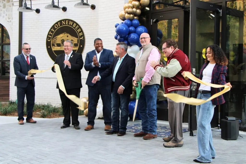 Officials from Newberry's elected City Commission cut the ribbon for the new city hall. Photo by Lillian Hamman