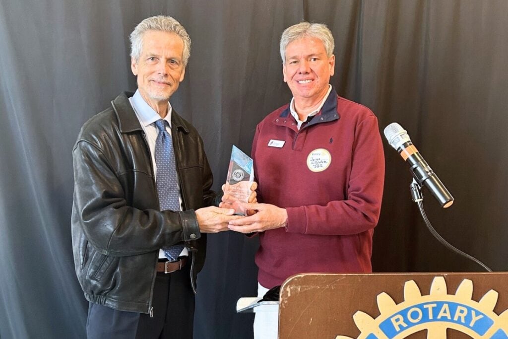 Scott Winzeler (left) of the Rotary Club of Gainesville presents Jorge Villalobos with the 2026 Ethics in Business Award.