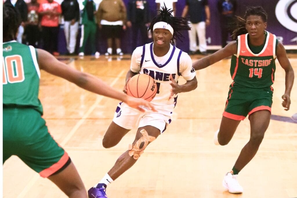 Willie Brooks (1) hit buzzer-beater baskets at the end of the first half and at the end of the game as the Hurricanes defeated Eastside, 52-50. Photo by C.J. Gish