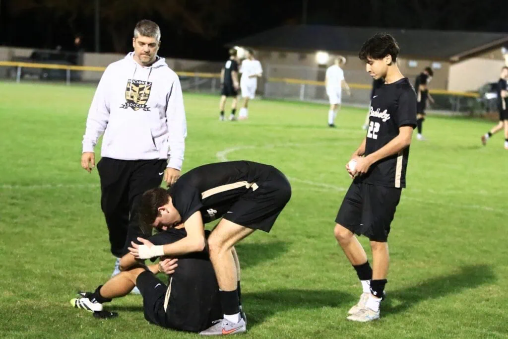 Buchholz players console each other following a 3-1 loss against South Lake (Groveland) in the Class 6A-Region 1 Semifinals. Photo by C.J. Gish