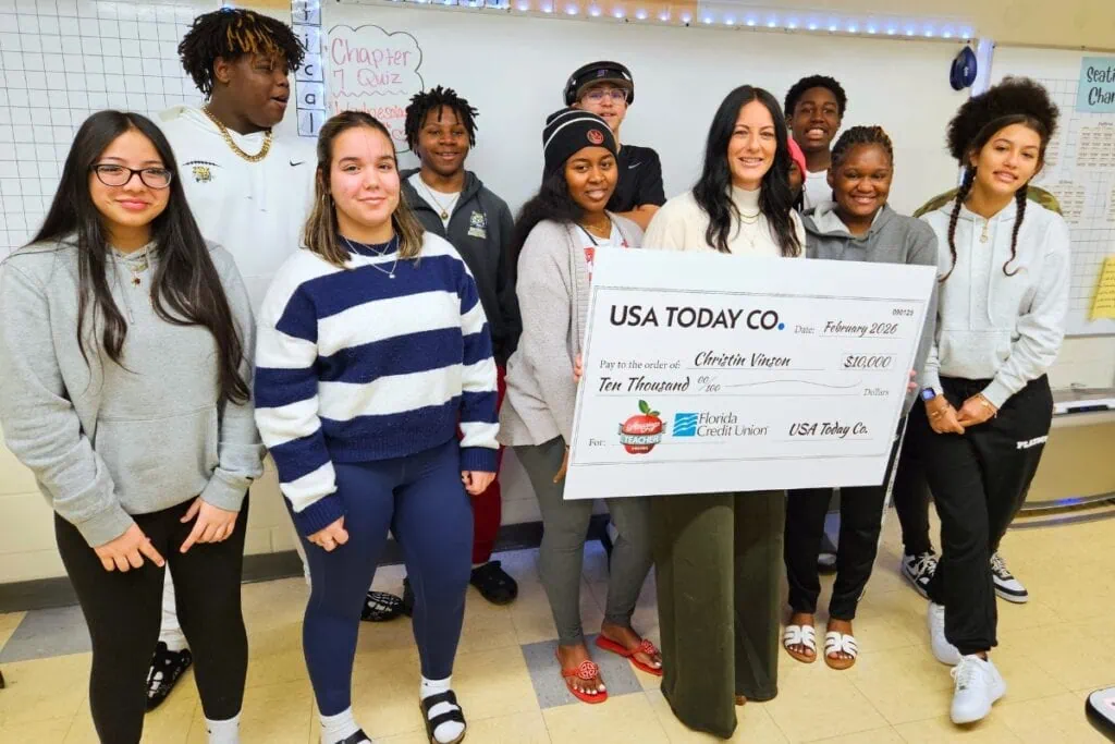 Buchholz teacher Christin Vinson (holding check) with her students after being named USA Today's Amazing Teacher of the Year for the month of December 2025. Courtesy of ACPS