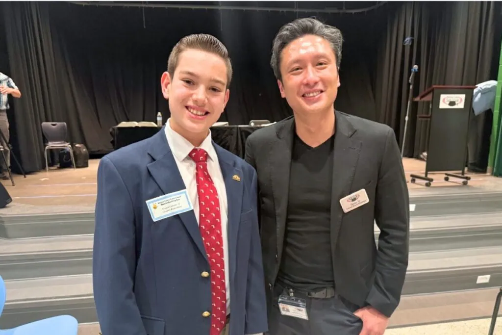 Cooper Campen (left) with Alachua County School Board Chair Thomas Vu following the 2026 Alachua County Spelling Bee on Wednesday. Courtesy of Brad Campen
