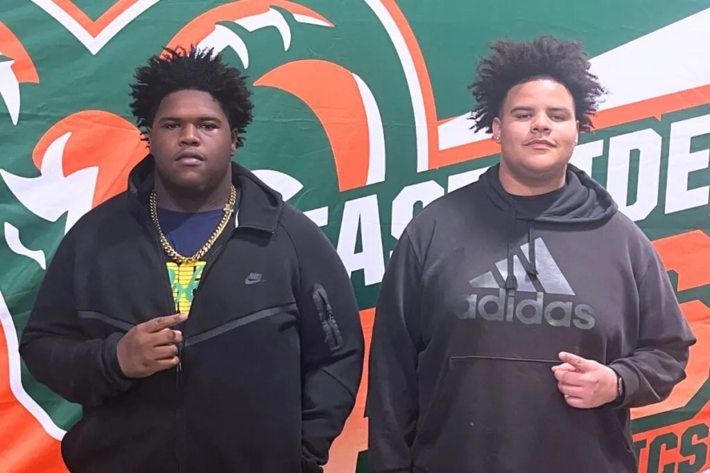 Eastside's Atonnis Ross (left) and Deavion McBride signed on Wednesday to play football at Trinity College of Florida. Photo by Mike Ridaught