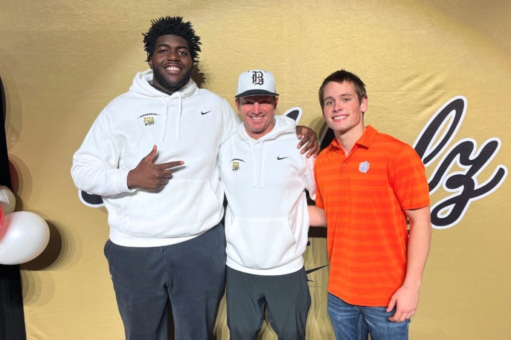 (From left) Michael Edwards, Buchholz coach Mark Whittemore and Keil McGriff at National Signing Day. Photo by Mike Ridaught