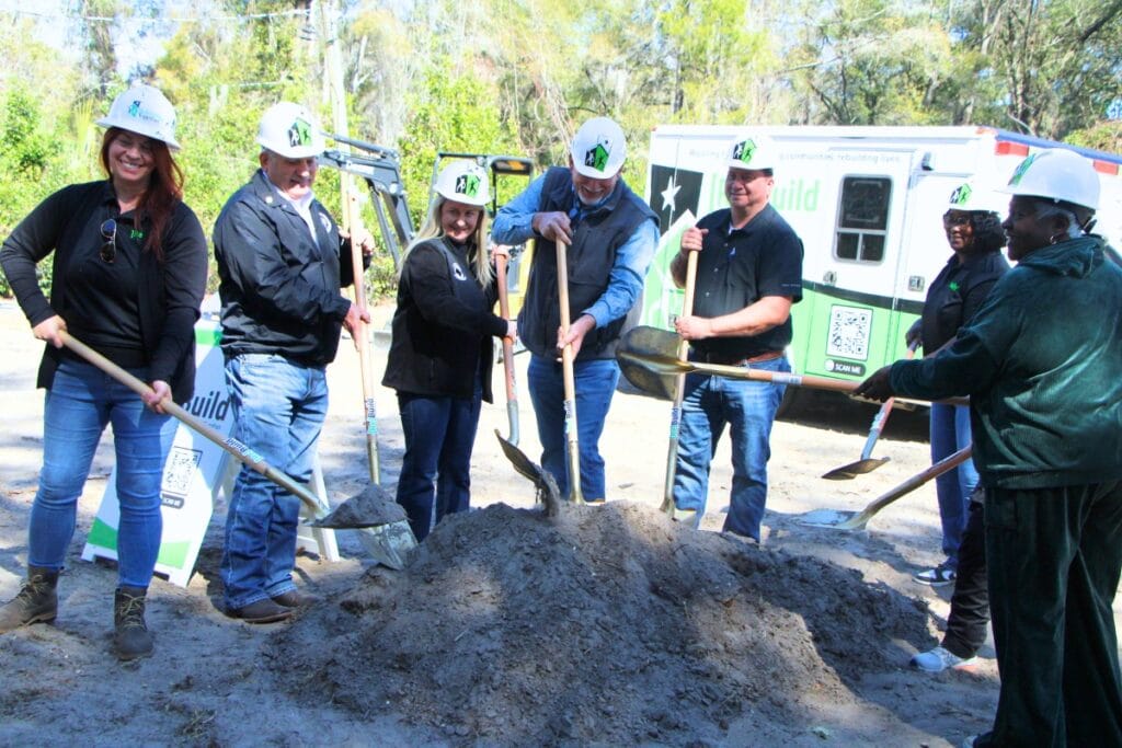 Members of the Levy County Board of County Commissioners break ground on Tlama White's new Chiefland home to be completed by May 2026. Photo by Lillian Hamman