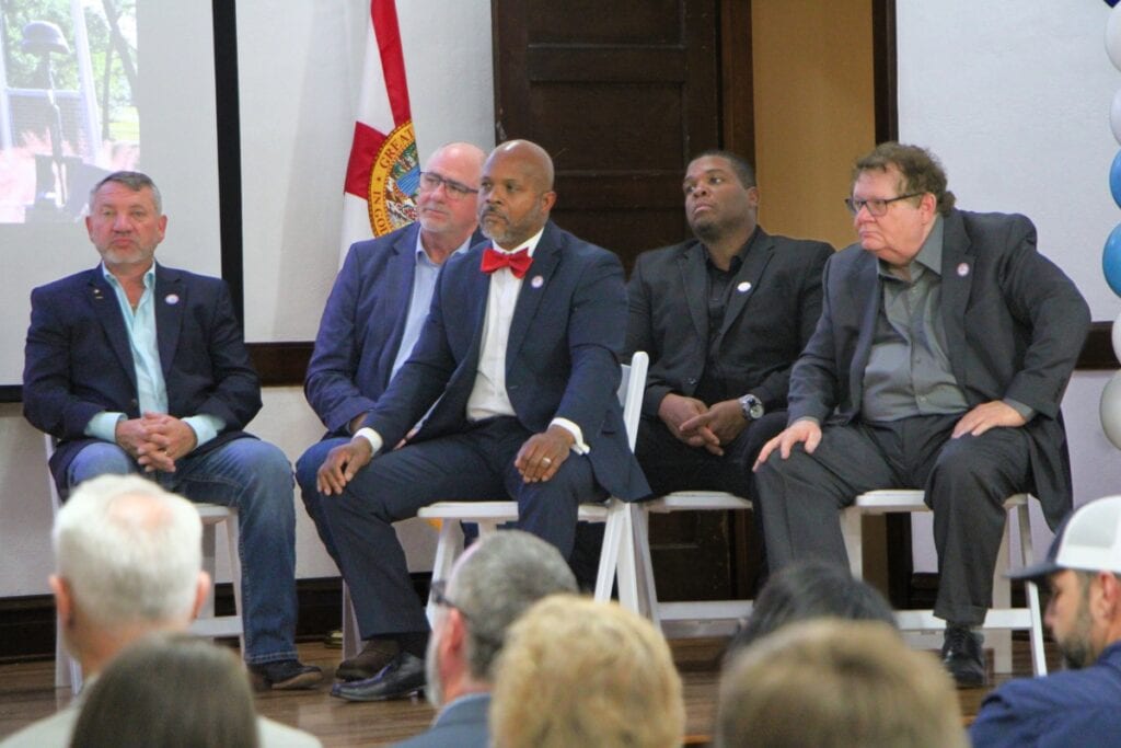 Newberry's city commissioners listen to the State of the City address.