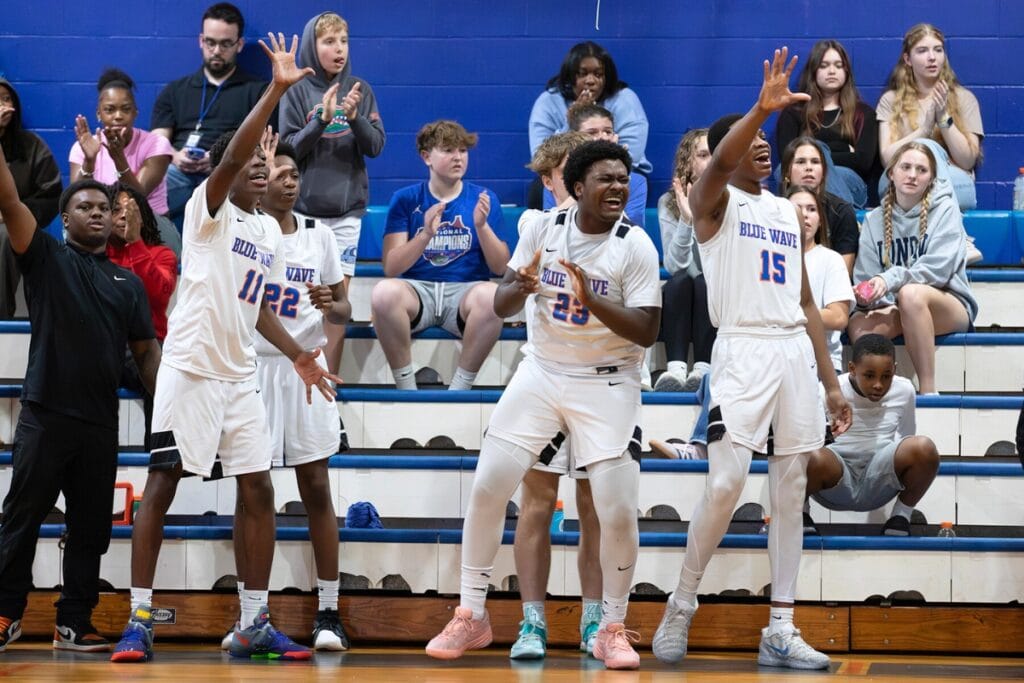 P.K. Yonge's bench celebrate a foul call against University Christian (Jacksonville) in the Class 2A-Region 1 Quarterfinals. Photo by Megan V. Winslow