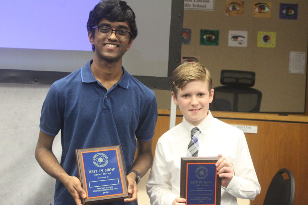 Pranav Mannam (left) and Finnegan Alread pose for a photo with their Best in Show plaques for the Senior Division and Junior Division, respectively. (Photo by Nick Anschultz)