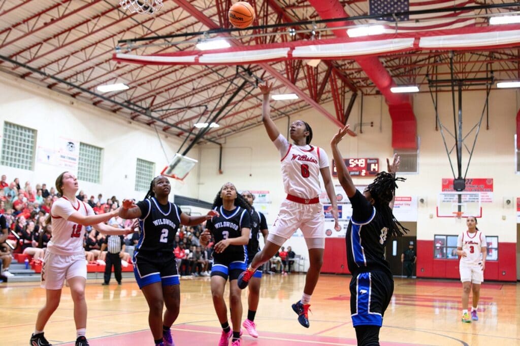 Williston's Ashlyn Young (0) puts up a shot against Wildwood in the Rural-Region 4 Final. Photo by Megan V. Winslow