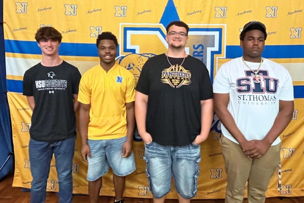 (From left) Caden Francis, Kaleb Woods, Brandon Sullivan and Je'Kai Dawson signed to play at the college level on Monday. Photo by Mike Ridaught