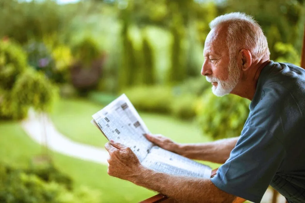 Man reading a newspaper.