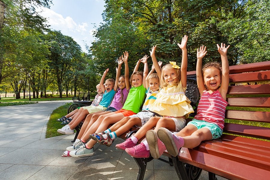 Happy children sitting together