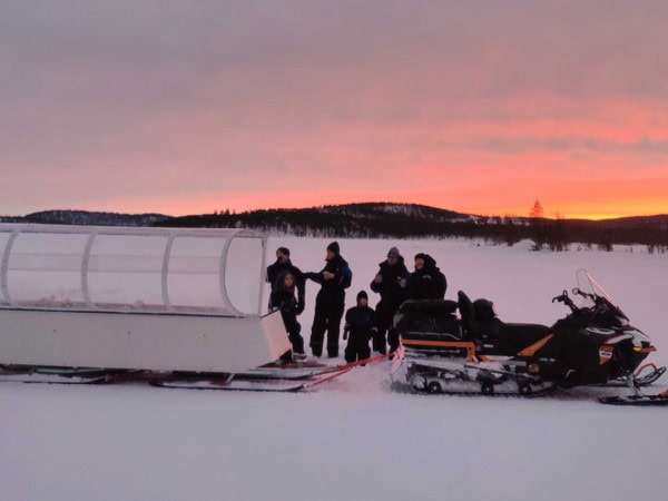 Polar Night Snowmobile Ride with Heated Sleigh
