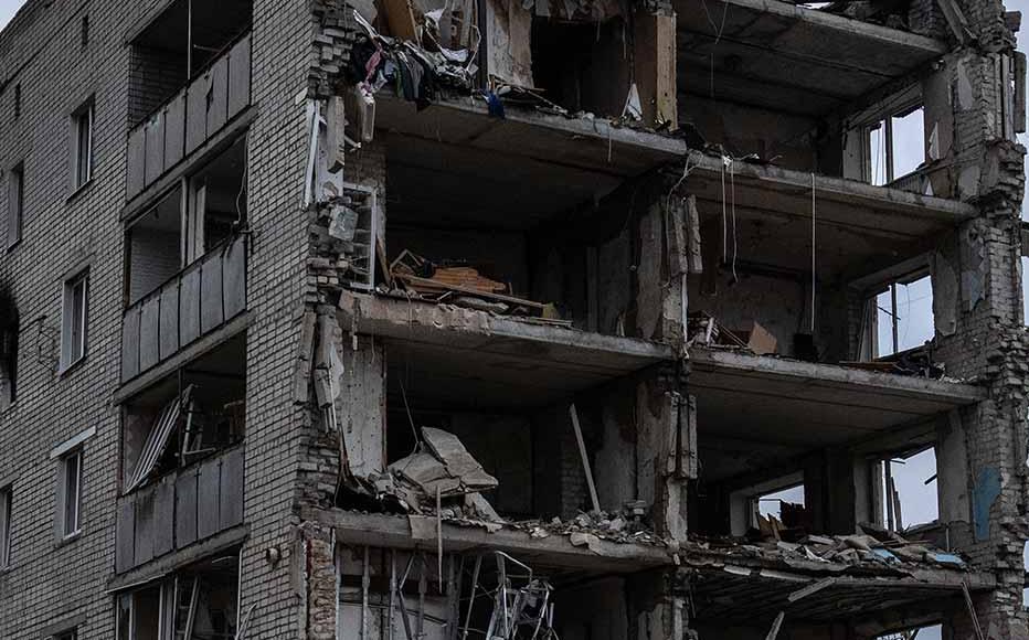 An apartment block lies in ruins after being destroyed during fighting between Ukrainian and Russian occupying forces, on October 24, 2022 in Izyum, Kharkiv oblast, Ukraine. Ukraine's intelligence chief has said that Russia is sending more troops into the city of Kherson and may be preparing to defend it against a Ukrainian counteroffensive.