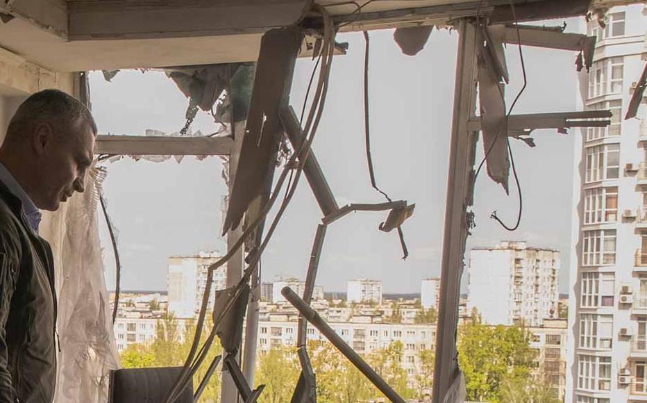 Mayor of Kyiv Vitali Klitschko visits an apartment damaged by the debris of a Russian intercepted drone, in a residential building on May 8, 2023 in Kyiv, Ukraine.