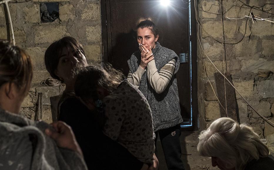 Residents shelter in a basement as air raid sirens sound in Stepanakert, Nagorno-Karabakh. (Photo: Brendan Hoffman/Getty Images)