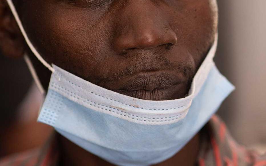 A healthcare professional is vaccinated against Covid-19 on March 10, 2021 in Kampala, Uganda.