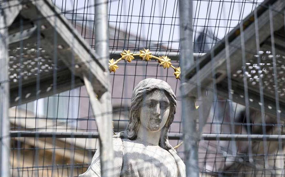 A statue of Mary is seen through protective scaffolding as the city attempts to protect its heritage from potential air strikes on April 20, 2022 in Lviv, Ukraine.