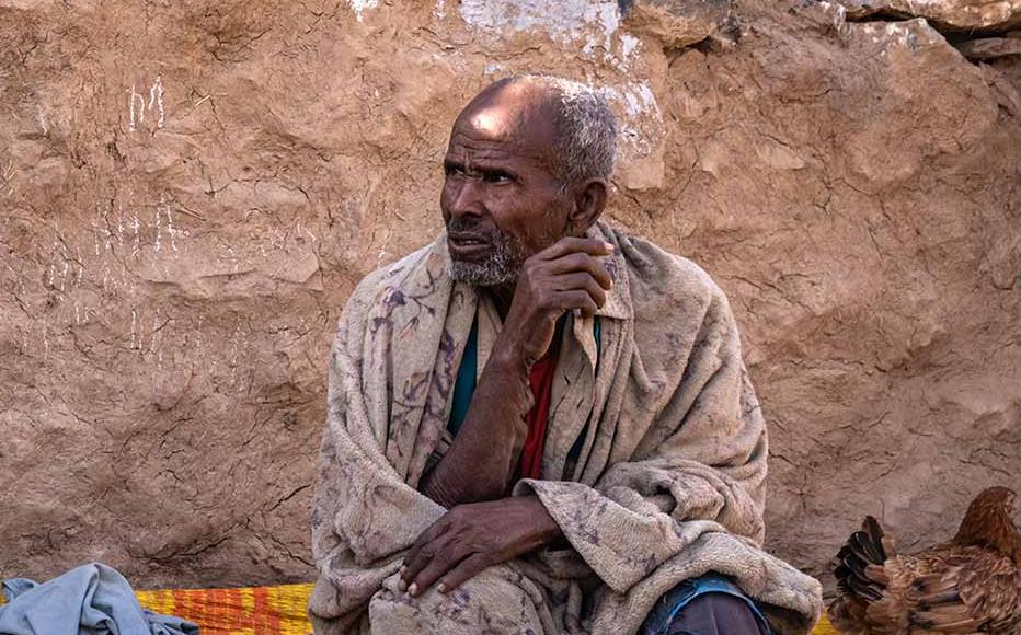 A family in front of of their house in the Yechila district on February 19, 2024 in Tigray Region, Ethiopia.