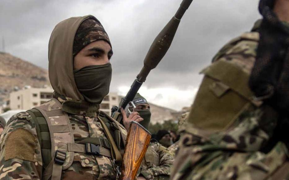 Soldiers from Hay'at Tahrir al-Sham (HTS) march through Umayyad Square Damascus, Syria.