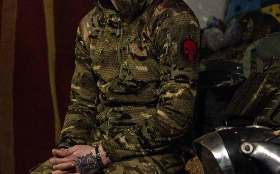 Service members of Ukraine's 13th Brigade Khartiia wait for the target's coordinates in a former house's garage to operate an American-supplied M101 howitzer on Russian combat positions on March 06, 2025, in the Kharkiv region of Ukraine.