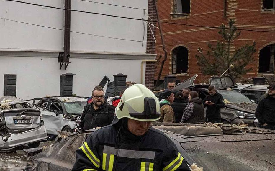 People try to clear the damage and locate their belongings at the scene of a Russian strike on September 28, 2025 in Kyiv, Ukraine. Ukrainian authorities said Russia launched another large overnight drone and missile attack on the capital. 