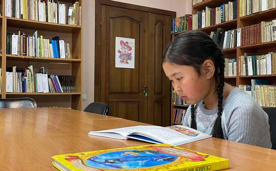 A girl reads a book in a reading room of Chuy regional library, in the town of Kant. Over 80 per cent of the 1,060 libraries in Kyrgyzstan are located in rural areas and in most villages they are the only cultural facility.