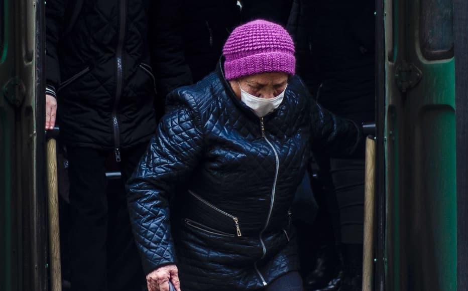 An elderly woman wears a mask on a bus in Tiraspol. An elderly woman wears a mask on a bus in Tiraspol.