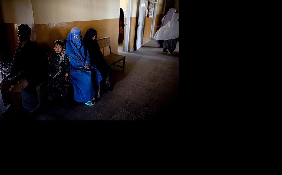 Afghans wait for treatment at a clinic near Kabul. (Photo: Majid Saeedi/Getty Images)