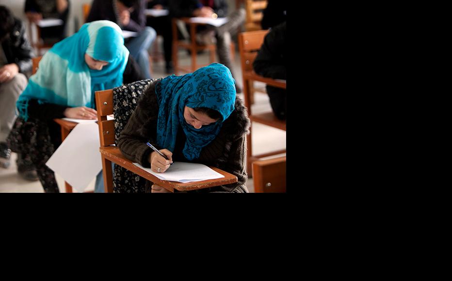 Young women study at an Afghan university. (Photo: Majid Saeedi/Getty Images)