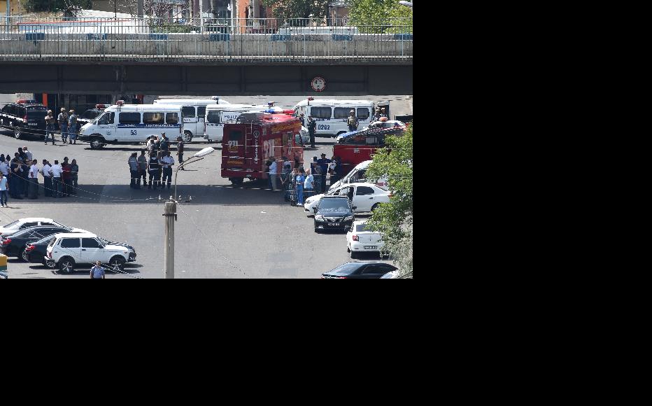 Police blocked a street after group of armed men seized a police station along with hostages. (Photo: Photolure Agency)