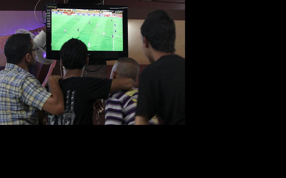 Football fans in Baghdad gather at a coffee shop to watch World Cup action. (Photo: Sirwan Aziz)