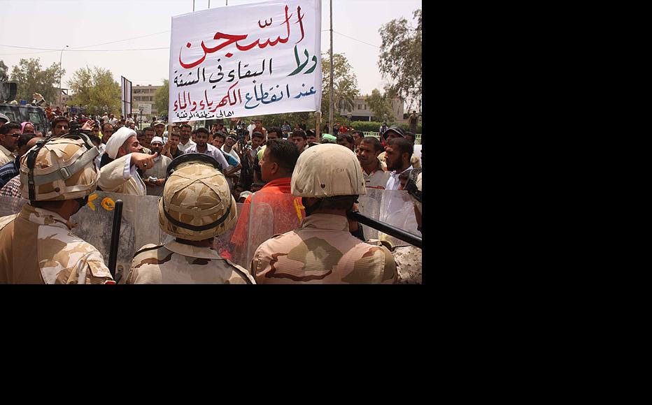At least two protesters were killed in clashes with government security forces June 23 in the southern city of Basra, as angry Iraqis took to the streets to demand more access to electricity. (Photo: Ali Abu Iraq)