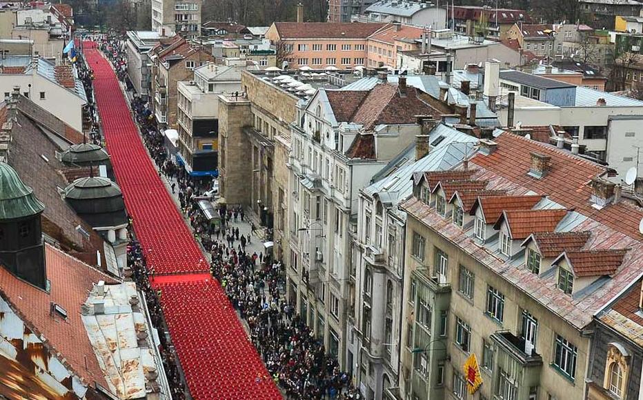 A broad ribbon of red chairs winds its way through Sarajevo, April 6, 2012.