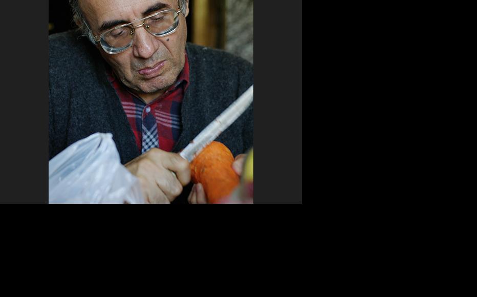 Abdumalik Mamirov, an ethnic Uighur from Kazakstan, is making plov in his house in Almaty. (Photo: Aziz Mamirov)