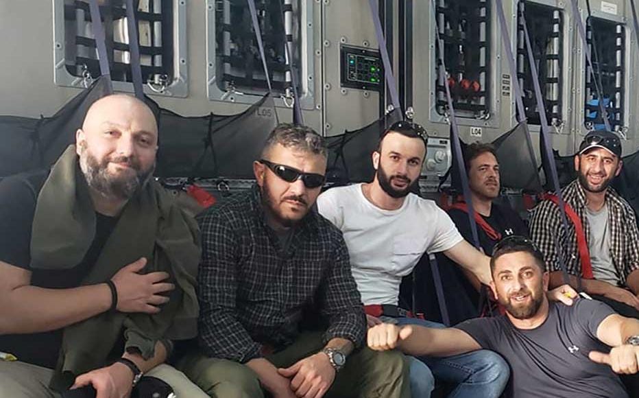 Levan Jangriashvili (in sunglasses), who worked in Afghanistan for many years, on his evacuation flight out of the country after the Taliban takeover