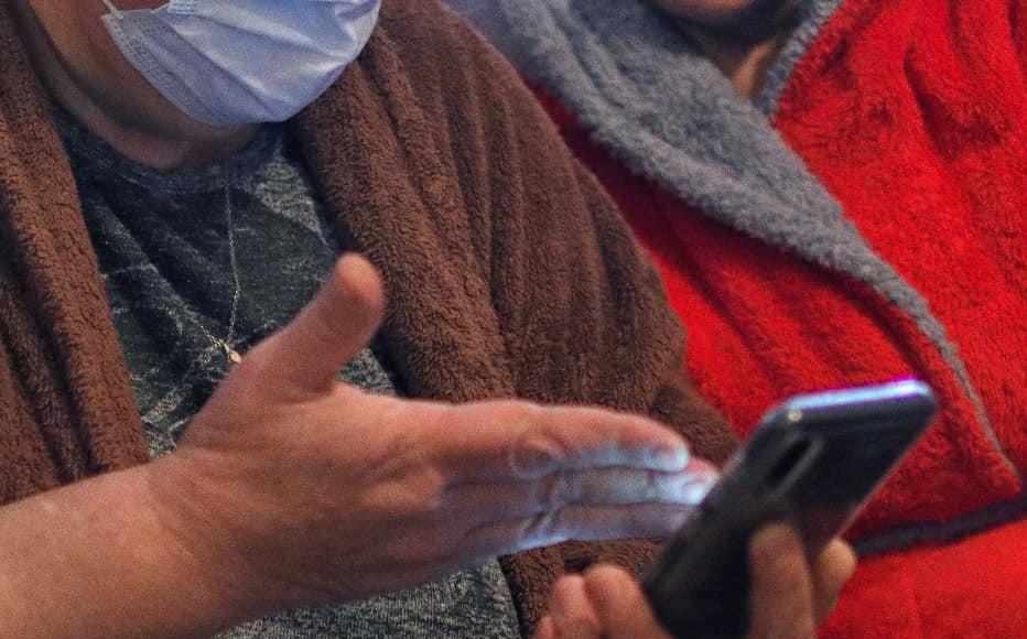 Irma Nachkebia and her neighbour Maluza Baghbaia, 54, from Ochamchire, watch videos of Sokhumi they found online. 