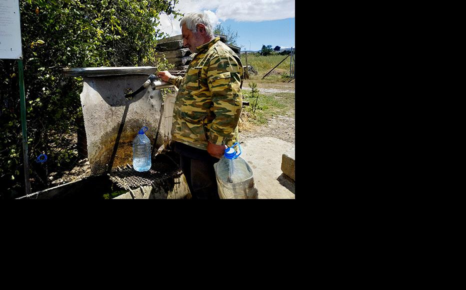 Spring water, which constantly flows from this handmade tap, is the only water source for the village of Nadarbazevi. (Photo: IWPR)