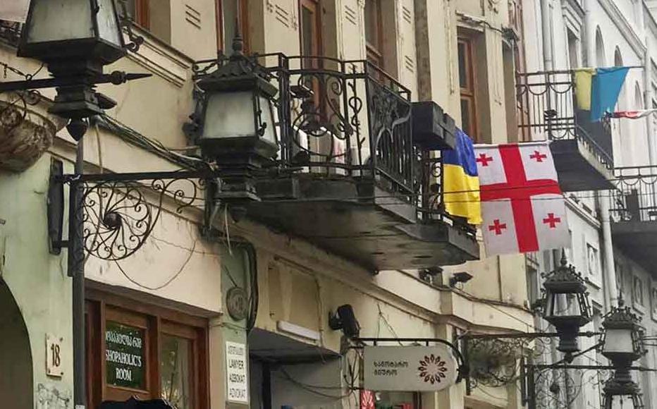 Ukrainian flags dot streets in Georgia's capital Tbilisi. Georgians overwhelmingly support Ukraine, but the government did not join its western allies in the sanctions against Moscow. Prime Minister Irakli Garibashvili stated that the country’s economy would suffer if Tbilisi sanctioned one of its main trading partners.