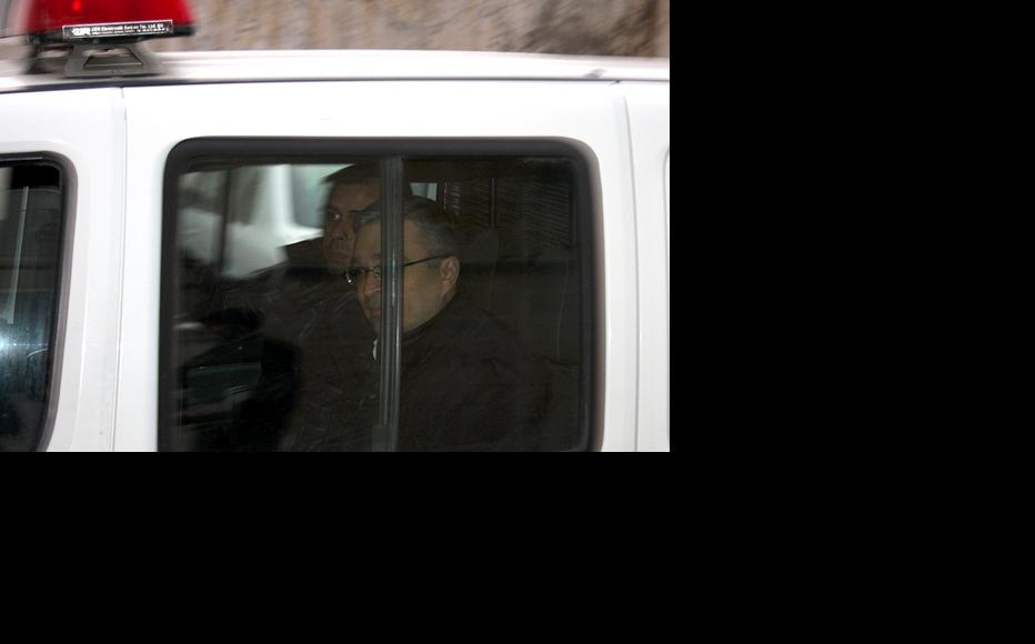 Ilgar Mammadov being driven away in a police car on the day of his arrest. February 2013. (Photo: Aziz Karimov)