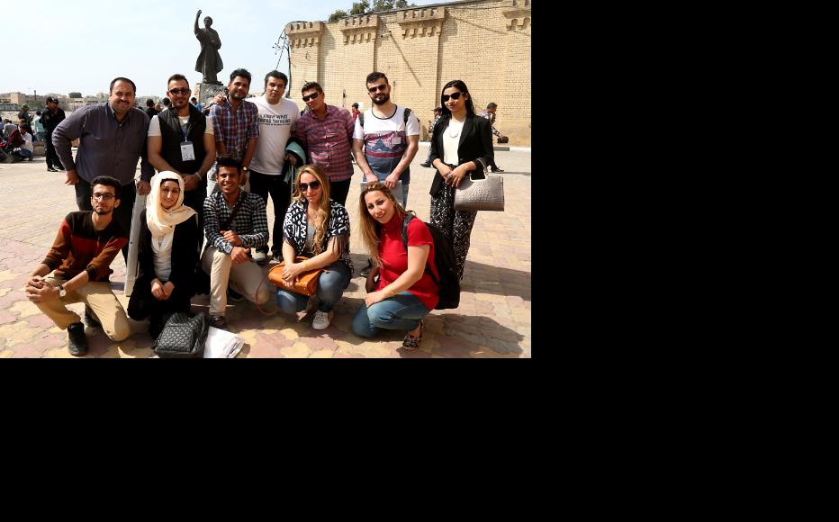 IWPR staff, members of RAIN organisation and the artists at al Mutanabbi Street in Baghdad. (Photo: IWPR)