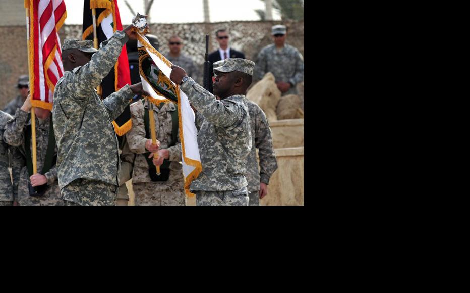 US military banner is furled in a ceremony to mark the end of US military operations in Iraq, December 15, 2011. (Photo: Sgt. Jessica M. Kuhn, XVIII Airborne Corps PAO/US Army)