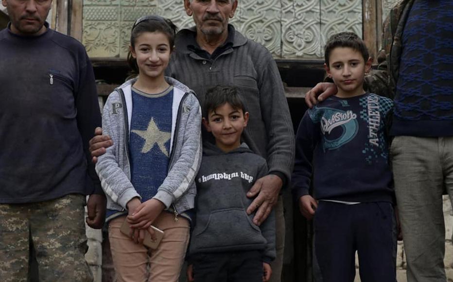 Galust with his sons Kajik and Gagik-a 42-year-old cattle breeder - and grandchildren.